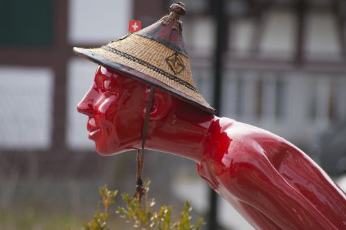 red sculpture figure