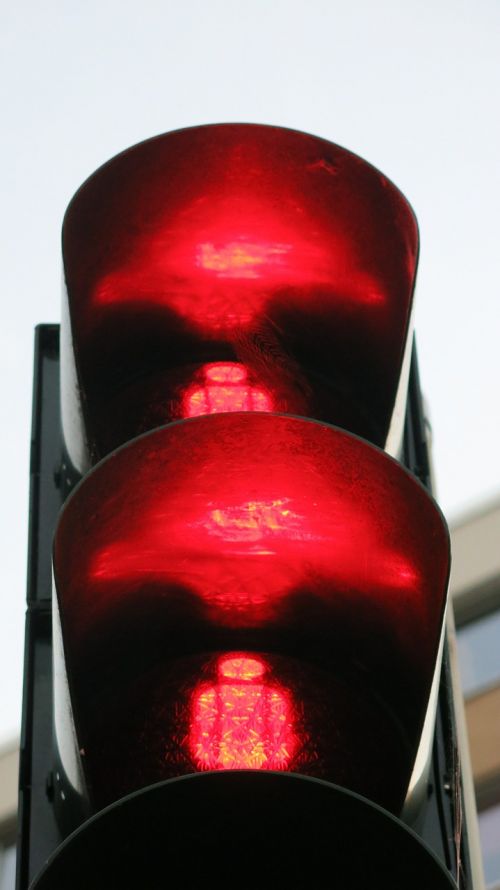 red traffic lights footbridge