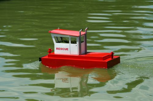 Red &amp; White Rescue Craft In Pond