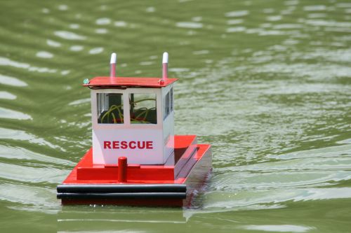 Red &amp; White Rescue Craft In Pond