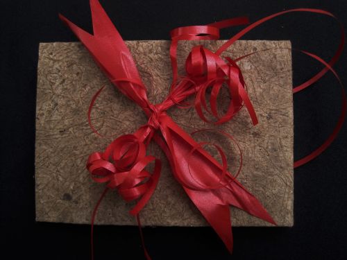 Red Bow On Textured Paper