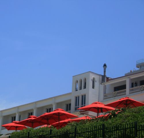 Red Umbrellas At Resort