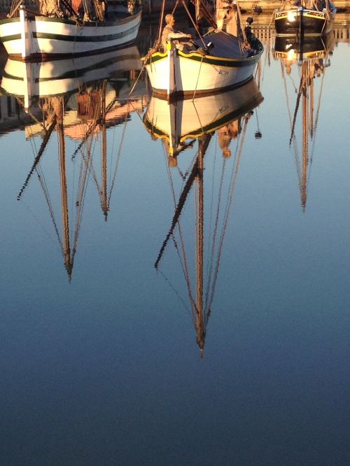 reflection boats water