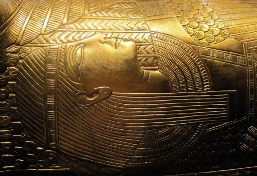 Relief Of Head In Gold On Coffin