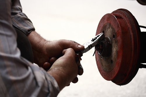 repairman  pliers  worker