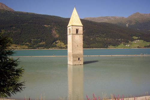 reschen pass tower in water landscape