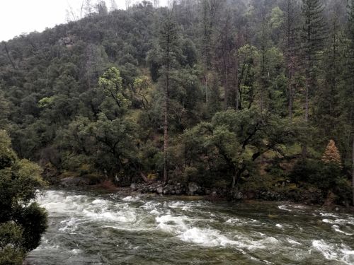 River Flowing Through Mountains