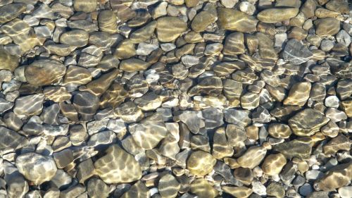 riverbed pebbles wave