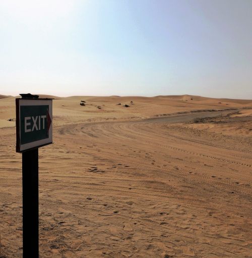 road sign desert sand