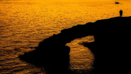 rock sunset sea