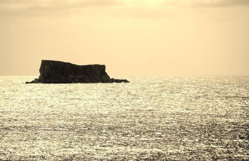 rock sea sunset