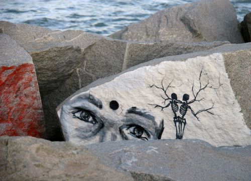 graffiti rocks breakwater
