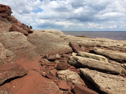 rocks shore sky