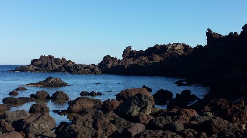 rocks lunar landscape sea