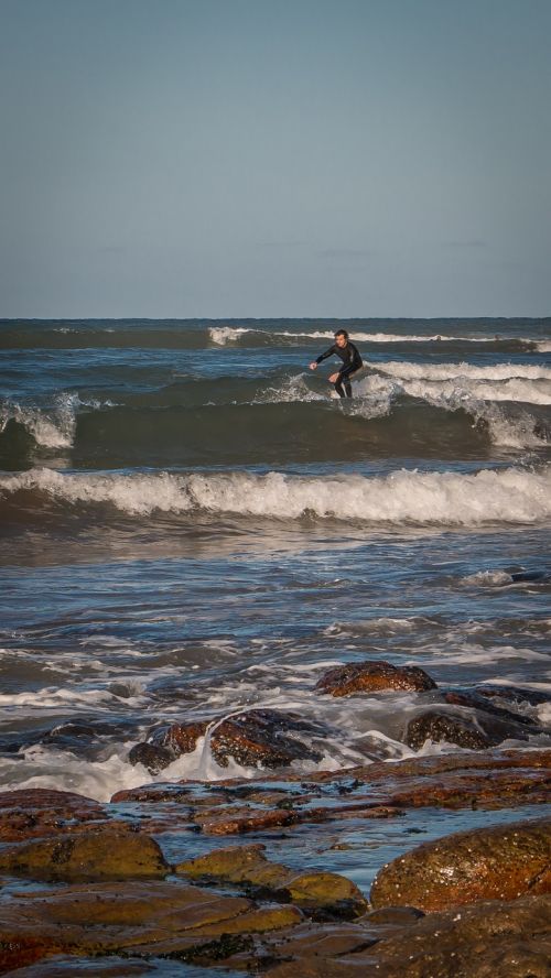 rocks surf sea