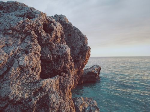 rocks caves ocean