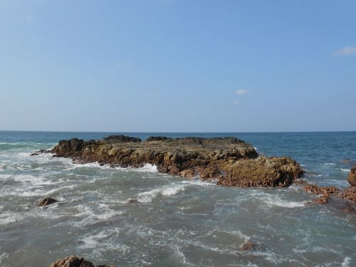 rocks ocean blue landscape