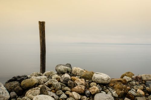 Rocks And Wooden Pole