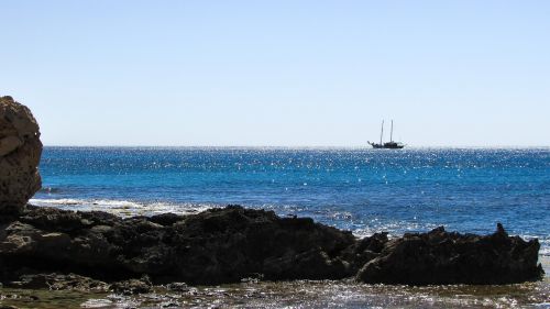 rocky coast sea boat