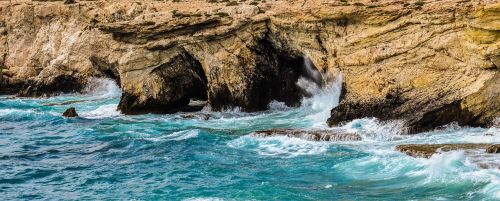 rocky coast sea caves waves
