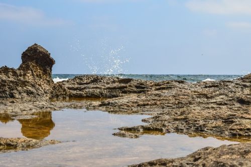 rocky coast water reflection