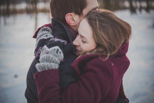 romance couple hugging wool coat