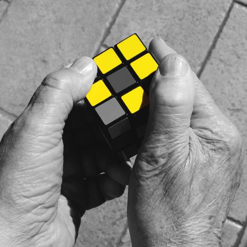 rubik's cube hands yellow