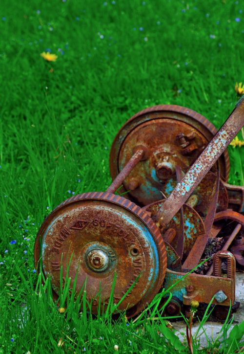 rusty lawnmower antique cutting