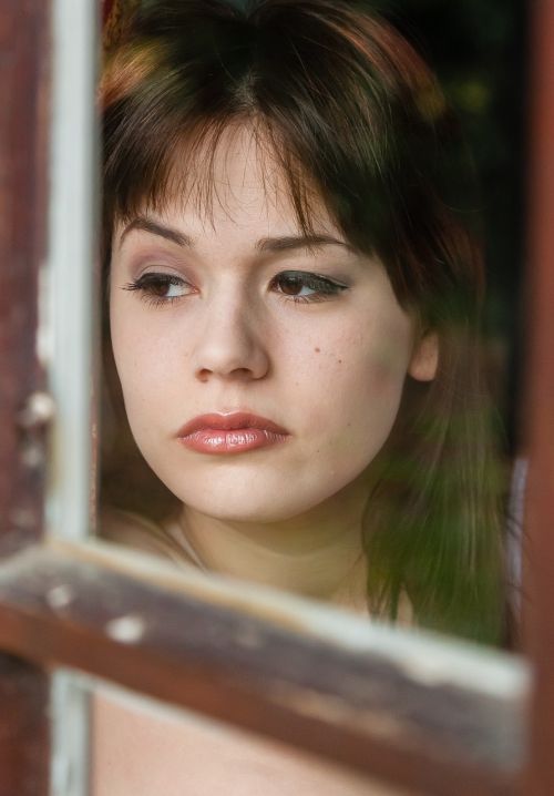 sad woman window staring