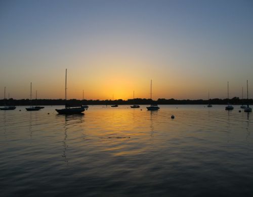 sailboat sunset lake
