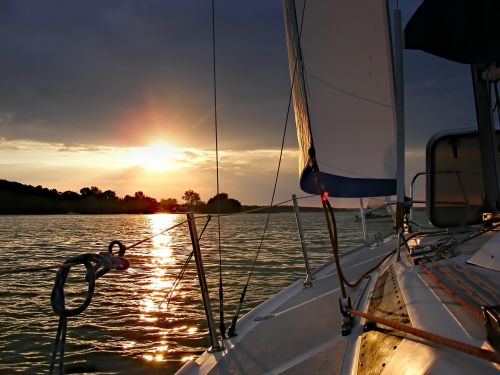 sailboat water sunset
