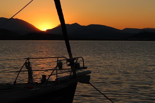 sailing boat  sunrise  mood