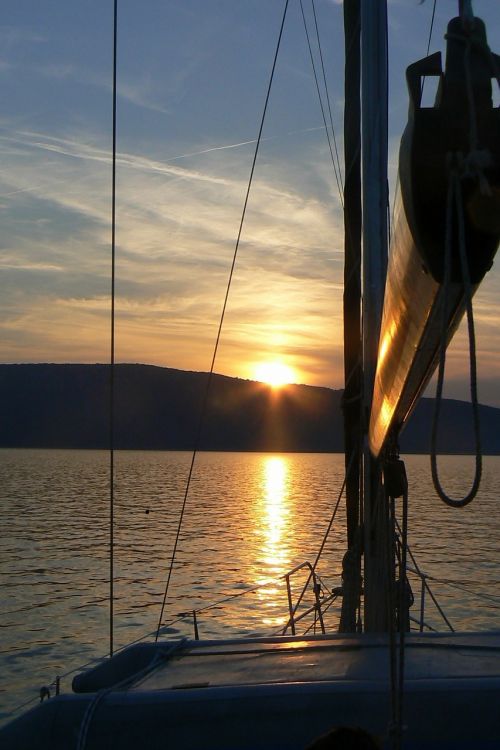 sailing boat water sunset