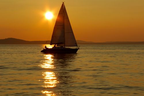 sailing boat sunset sea