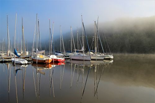 sailing boats fog water