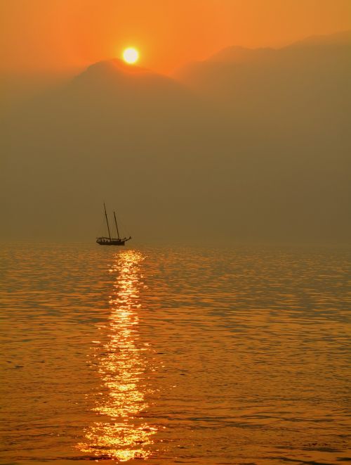 sailing ship lake sunset