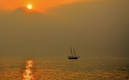 sailing ship lake sunset