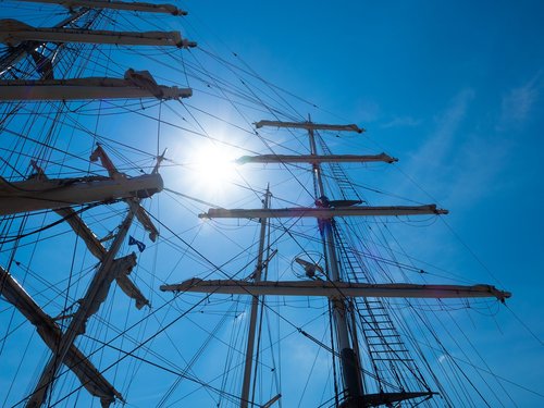 sailing vessel  sun  blue