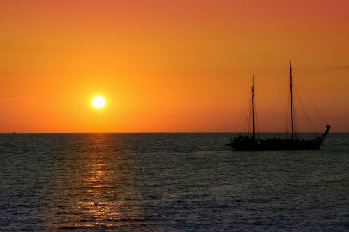 sailing vessel sunset sea