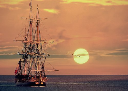 sailing vessel  sunrise  sunset