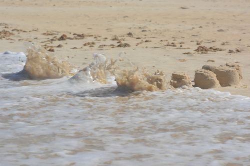 sand castle waves beach