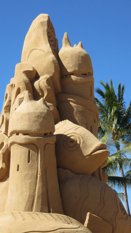 sand castle sculpture beach blue sky