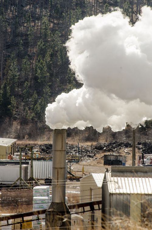 sawmill sawmill smokestack smoke