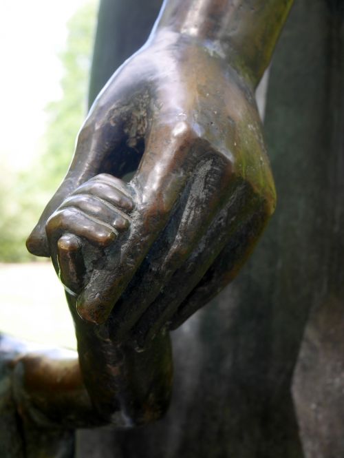 sculpture hand in hand child's hand