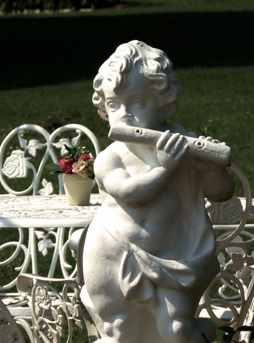 sculpture stone figure flautist
