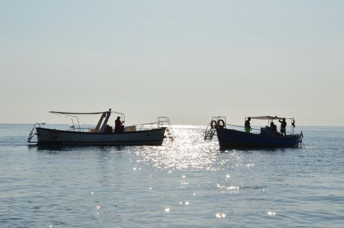 sea sunset boats