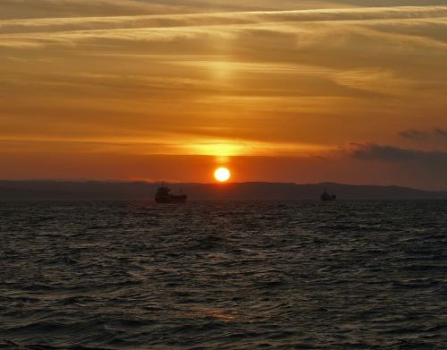 sea sunset two ships of the