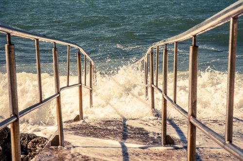 sea wave shores railing