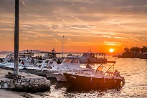 sea sunset boats