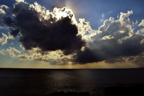 sea clouds sunlight